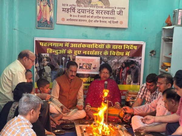 यज्ञ करते विहित कार्यकर्ता