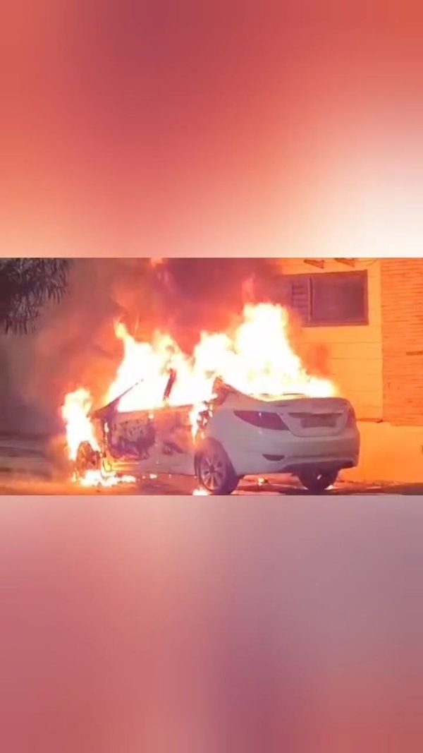 A car parked outside a house in a posh city colony was set on fire after being doused with petrol.