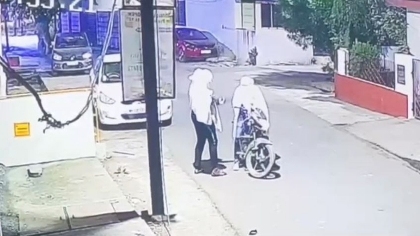 A car parked outside a house in a posh city colony was set on fire after being doused with petrol.