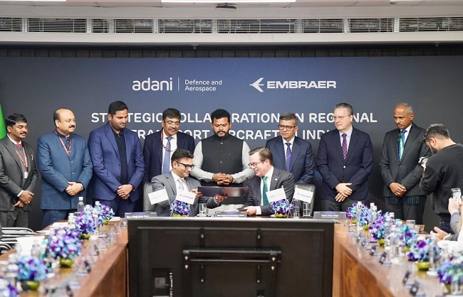 अडाणी समूह और एम्ब्रेयर के बीच समझौते का जारी फोटो अडाणी समूह और एम्ब्रेयर के बीच समझौते का जारी फोटो