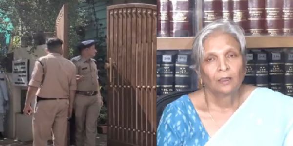 गिरिबाला सिंह के घर के बाहर खड़ी पुलिस गिरिबाला सिंह के घर के बाहर खड़ी पुलिस