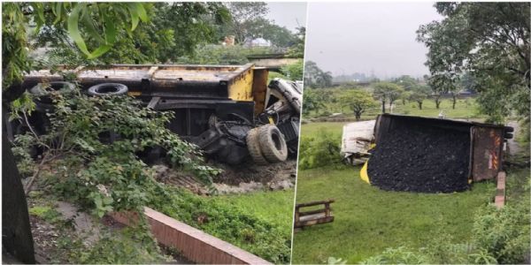 कोयला लदा तेज रफ्तार ट्रेलर रेलिंग तोड़कर गार्डन में पलटा, चालक घायल